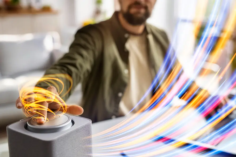 Person using digital print device with colorful light trails.